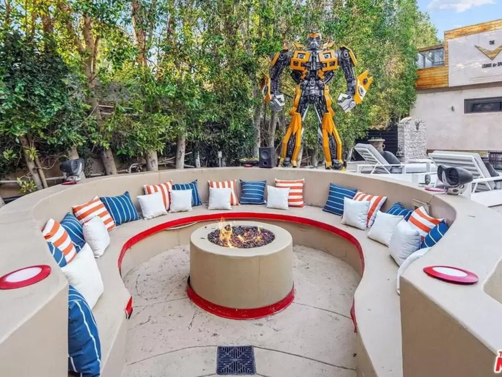 The home has a huge replica Transformer in the backyard. Picture: Realtor