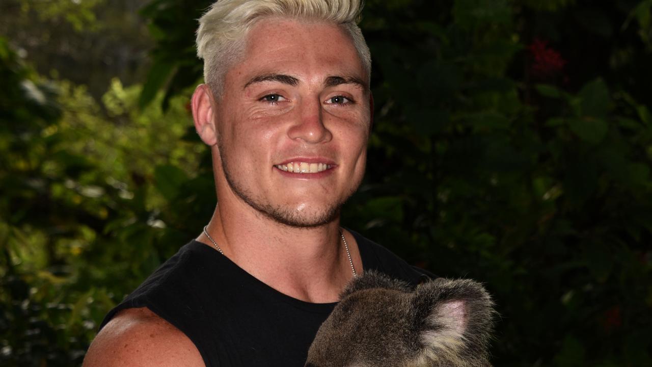 James O’Connor holds a koala at Currumbin Wildlife Sanctuary.