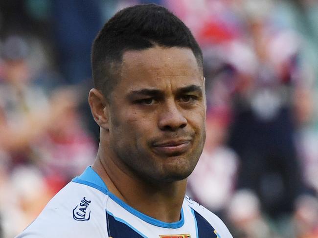 Jarryd Hayne of the Titans gestures after accidentally kicking the ball into touch which then allowed the Roosters to get possession, score and win the game during the NRL Round 26 rugby league match between the Sydney Roosters and Gold Coast Titans at the Allianz Stadium in Sydney, Saturday, September 2, 2017. (AAP Image/David Moir) NO ARCHIVING, EDITORIAL USE ONLY