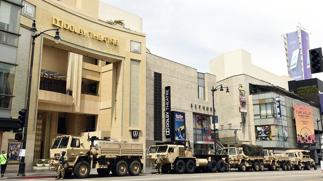 US National Guard trucks and troops line up in front of the Dolby Theatre, in the Hollywood area of Los Angeles.