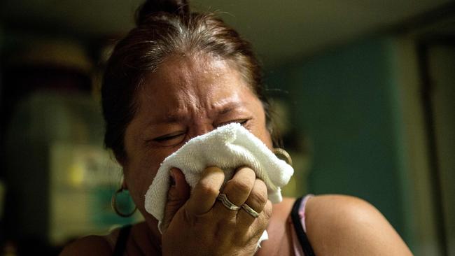 Chona Balina, the sister of the alleged drug dealer who was gunned down by unidentified men inside his house, reacting to her brother's death in Manila. Picture: AFP / Noel Celis.