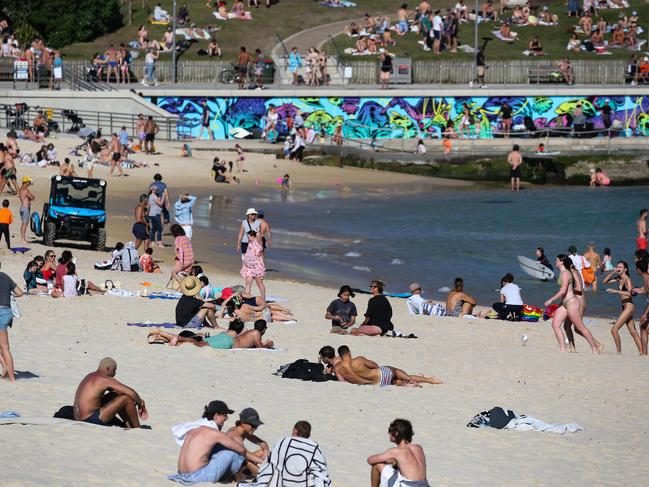 SYDNEY, AUSTRALIA - NewsWire Photos, SEPTEMBER, 20 2021: Plenty of beach goers at Bondi Beach today enjoying the warm weather while we remain in Covid-19 Lockdown in Sydney. Picture: NCA NewsWire / Gaye Gerard