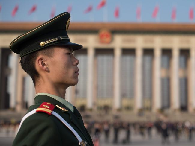 A paramilitary policeman stands guard at Tiananmen Square during the closing session of the Communist Party Congress. Picture: Nicolas Asfouri/AFP