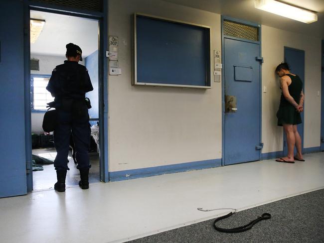Corrective Services officers raid cells at Silverwater Jail looking for contraband. The officers now wear body cams that record the raids. Picture: Richard Dobson