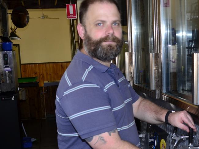 Commercial Hotel's Andrew Wyeth pours a Home Hill Lager beer at his premises.