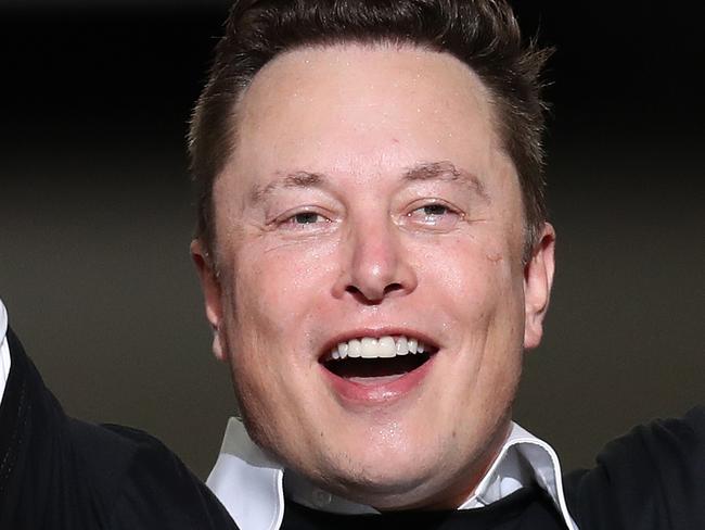 (FILES) In this file photo taken on May 30, 2020, Spacex founder Elon Musk celebrates after the successful launch of the SpaceX Falcon 9 rocket with the manned Crew Dragon spacecraft at the Kennedy Space Center in Cape Canaveral, Florida. - Musk, the outspoken and envelope-pushing chief executive of Tesla, overtook Amazon boss Jeff Bezos to become the world's wealthiest person, US media reported on January 7, 2021. (Photo by JOE RAEDLE / GETTY IMAGES NORTH AMERICA / AFP)