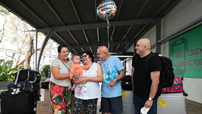 Grandparents Toni and Theo Lyras (centre) meet their nine-month-old granddaughter Emillia Puligheddu for the first time. Picture: Adam Yip