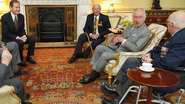 LONDON, ENGLAND - MARCH 19: King Charles III (2nd R), along with Master of The King's Household, Vice Admiral Sir Tony Johnstone-Burt (3rd L) during an audience with Veterans of the Korean War (L-R) Alan Guy, Mike Mogridge, Brian Parritt and Ron Yardley at Buckingham Palace on March 19, 2024 in London, England. (Photo by Jonathan Brady - WPA Pool/Getty Images)