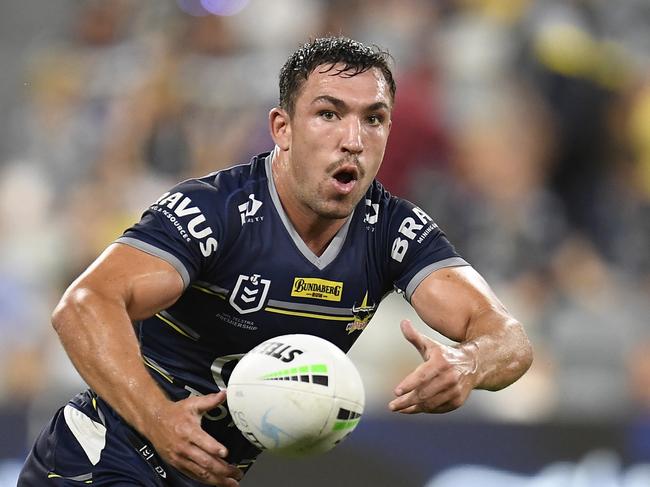 TOWNSVILLE, AUSTRALIA - SEPTEMBER 04:  Reece Robson of the Cowboys passes the ball during the round 25 NRL match between the North Queensland Cowboys and the Manly Sea Eagles at QCB Stadium, on September 04, 2021, in Townsville, Australia. (Photo by Ian Hitchcock/Getty Images)