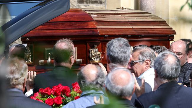 The coffin carrying Joe Acquaro was carried from the church. Picture: Ian Currie