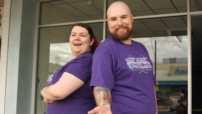 Kacey Gnitecki and Paul Briske outside their Infinite Worlds Tattoo parlour on Main North Rd, Prospect. Picture: Eugene Boisvert