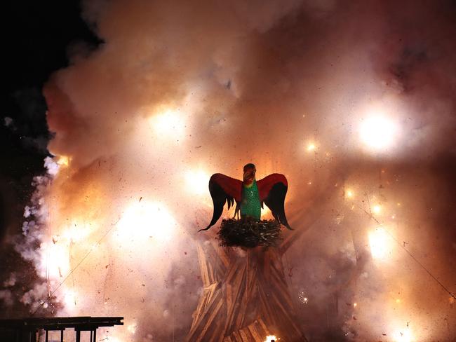 The Swift Parrot surrounded fireworks going off at the Ogoh Ogoh burning at Macquarie Point. Picture: LUKE BOWDEN