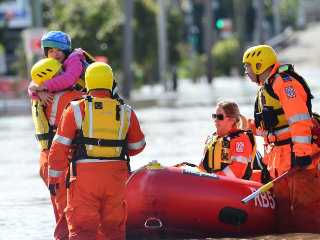 MELBOURNE, AUSTRALIA - OCTOBER 14TH, 2022: Maribyrnong Floods, Melbourne. Little girl being rescued by the SES at Raleigh Rd.Picture: Nicki Connolly