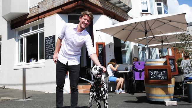 Owner Hartmut Schacker with Kia the dog at The Bower restaurant Manly. Picture: Braden Fastier