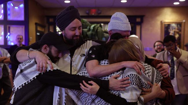 Attendees console each other during an ‘Uncommitted for Joe Biden’ primary election night watch party in Dearborn, Michigan. Picture: AFP