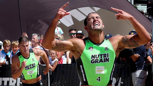 Matt Poole crosses the line to win the Nutri-Grain Ironman series in front of runner up Shannon Eckstein at North Cronulla Beach. Picture: Gregg Porteous