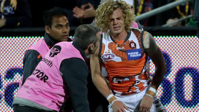 Adam Kennedy gets some medical attention after landing heavily. Picture: Simon Cross