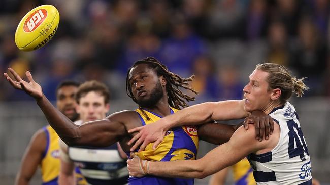 Nic Naitanui gets the better of Mark Blicavs as the Eagles emerge triumphant.