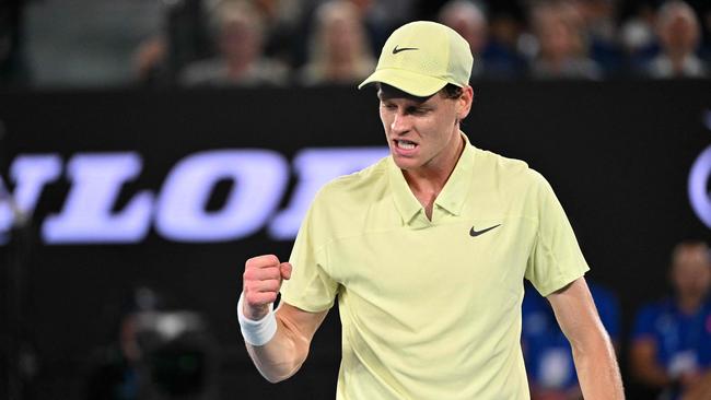 Italy's Jannik Sinner reacts after a point against USA's Ben Shelton during their men's singles semi-final match on day thirteen of the Australian Open tennis tournament in Melbourne on January 24, 2025. (Photo by WILLIAM WEST / AFP) / -- IMAGE RESTRICTED TO EDITORIAL USE - STRICTLY NO COMMERCIAL USE --