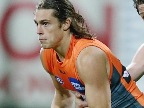AFL Round 11. Geelong v GWS Giants at Simonds Stadium. Jack Steele tries to clear but Patrick Dangerfield has a diffent idea . Pic: Michael Klein.