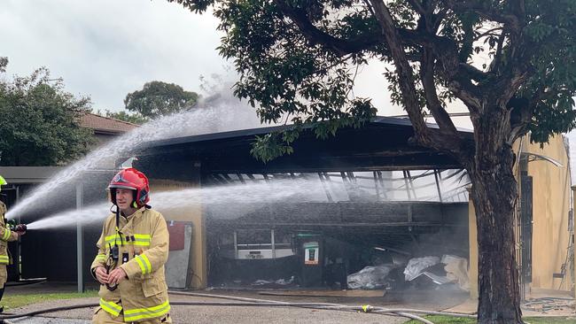 Firefighters fight to contain a garage fire in Seaforth. Picture: Max Agency