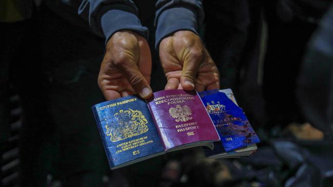 Bloodstained British, Polish, and Australian passports found after the strike in Deir al-Balah on Monday. Picture: AFP