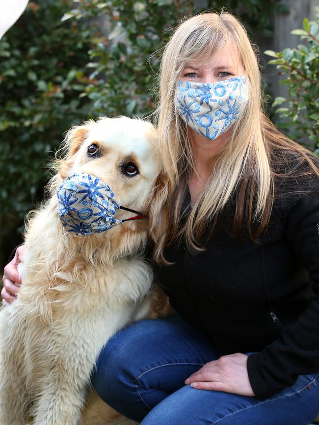 Franklin models one of Maz Clark's face masks made partially from wetsuit material. Picture: Alison Wynd