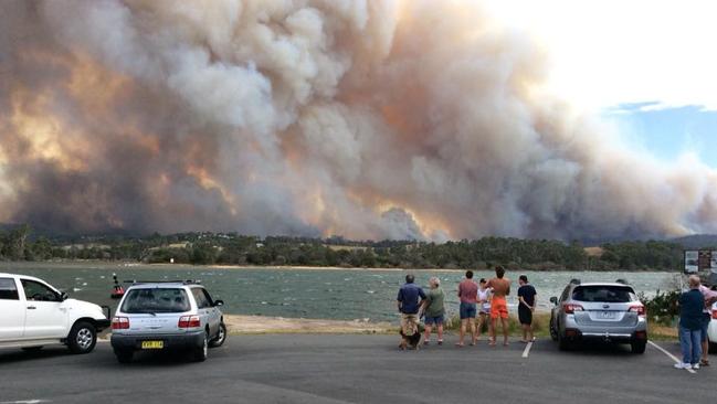 Residents watch as the fire approaches Tathra. Picture: Facebook