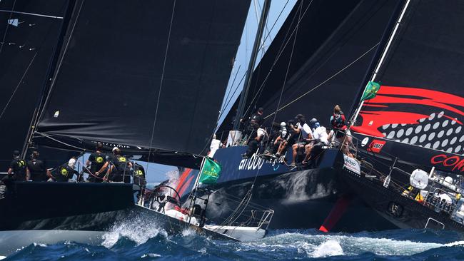 Yachts Moneypenny (L) and Andoo Comanche going head to head at the start of the 2022 Sydney to Hobart.