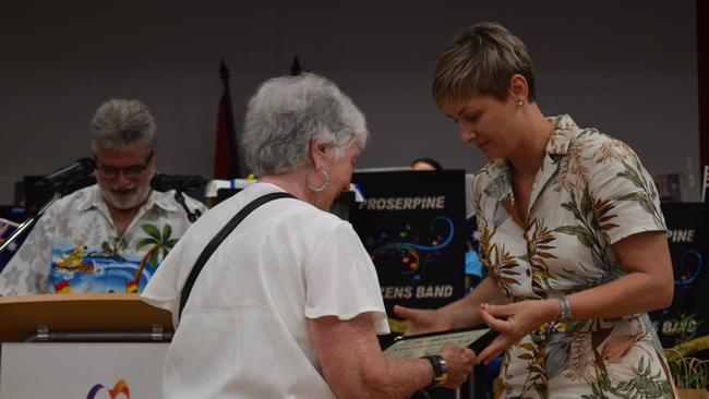 Senior Citizen of the Year for Airlie Beach, Cannonvale, Proserpine and surrounds Colleen Byrnes accepts her award from Whitsunday MP Amanda Camm. Picture: Elyse Wurm