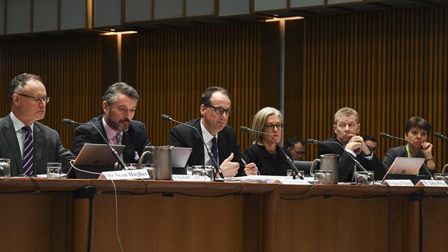 Chair of the Australian Securities and Investments Commission (ASIC) James Shipton (centre) speaks during a Parliamentary Joint Committee on Corporations and Financial Services at Parliament House in Canberra, Friday, September 13, 2019. (AAP Image/Lukas Coch)