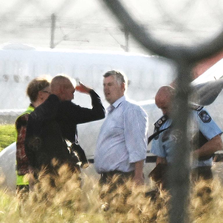 QLD Premier Steven Miles and staff exit a private jet, VH-VKX, at the Government Air Wing, Brisbane Airport. pic: Lyndon Mechielsen/Courier Mail