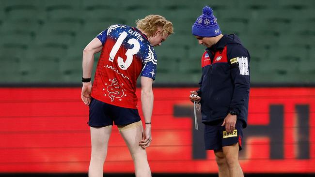 MELBOURNE, AUSTRALIA - JUNE 12: Clayton Oliver of the Demons speaks with medical staff while training after the 2023 AFL Round 13 match between the Melbourne Demons and the Collingwood Magpies at the Melbourne Cricket Ground on June 12, 2023 in Melbourne, Australia. (Photo by Michael Willson/AFL Photos via Getty Images)