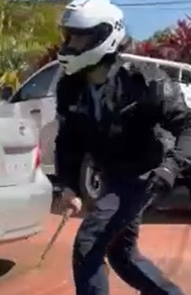 Screen grabs of the Tik Tok video, showing the helmeted officer wielding the baton. Picture: Supplied