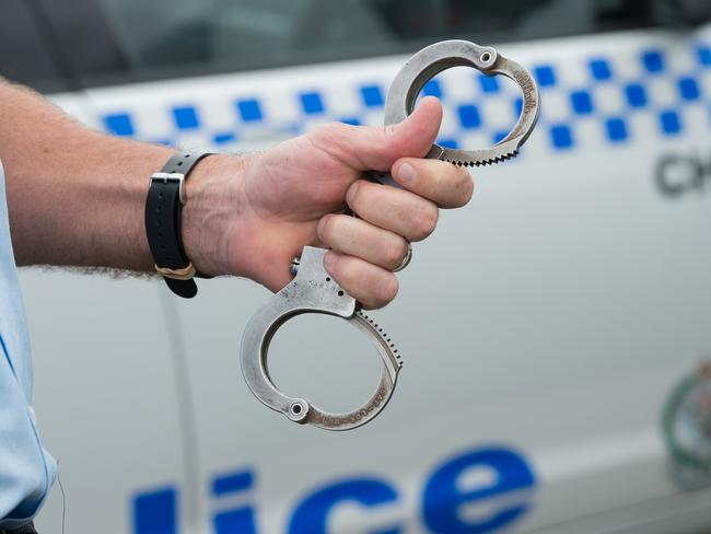 NSW police at coffs harbour boat ramp, arrest , gun, shots, handcuffsPhoto: Trevor Veale / The Coffs Coast Advocate