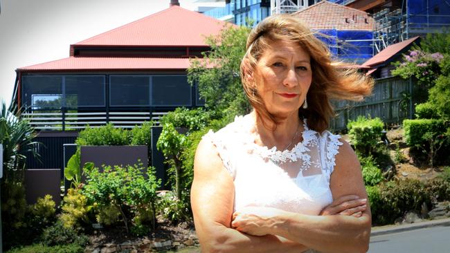 Katharine Baynham is among a group of residents protesting plans to redevelop a property with a heritage-listed building on it in Kangaroo Point. Picture: Jamie Hanson