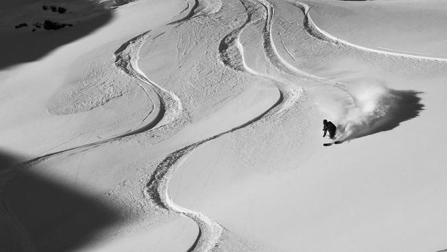 A skier carving it up in the Purcell Mountains.