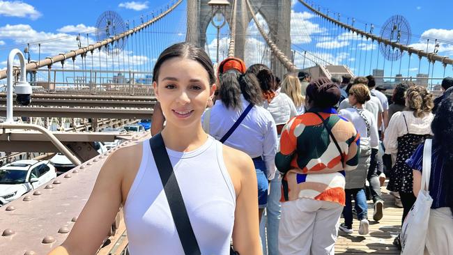 Junior saleswoman Alishia Lambropoulos at the Brooklyn Bridge in New York.