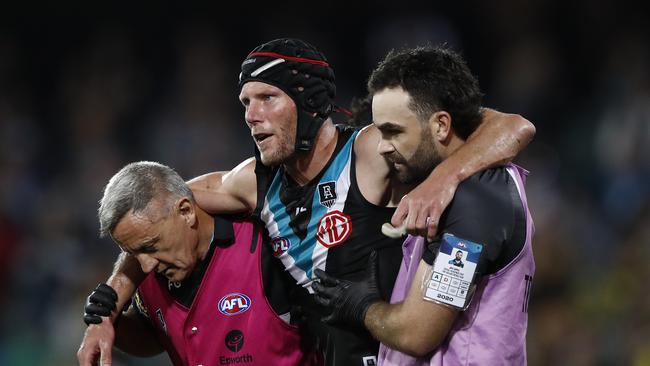 Brad Ebert being helped off after a head knock in his final game. Picture: Getty Images