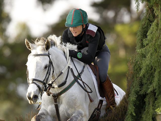 Giddyup: Ms Lee competing in the Melbourne International equestrian event in 2015. She hopes their husband and wife gin distillery is well received. Picture: Yuri Kouzmin