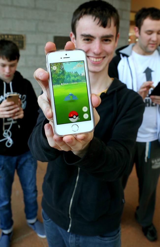 Peter Levin, 13, (PedroStalin), Samuel Levin, 17 (MegaSamNinja) and Mitchell Stanford (TheMasterSaiyan), 2 were among almost 1000 people at Penrith City Library to play Pekemon Go. Picture: Stephen Cooper