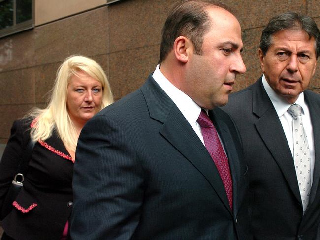 15 Nov 2004 : Gangland boss, Tony Mokbel with his legal team Nicola Gobbo (left) and Con Heliotis QC (right) outside the Magistrates Court - crime Vic drugs headshot mobile phone profile