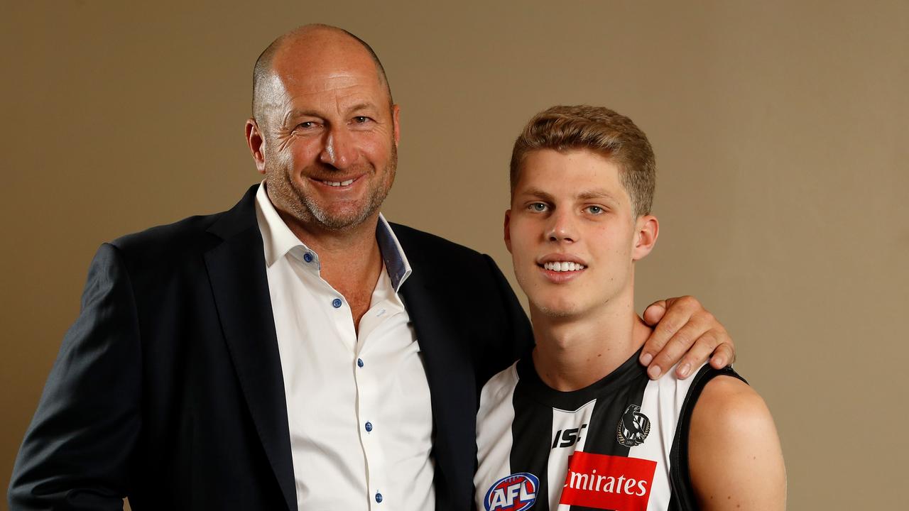 Craig Kelly, with son Will, has stuck close to sports in his business career. Picture: Adam Trafford