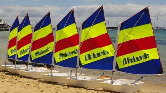 Narrabeen Lakes Sailing Club was donated eight "Opti" sailing boats by Whitworths Marine and Leisure so it can continue its learn to sail classes after a fire destroyed the clubhouse and 24 boats in November 2021. Picture: Narrabeen Lakes Sailing Club