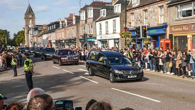 People gather in tribute as the cortege carrying the coffin of the late Queen Elizabeth II passes through Banchory. Picture: Getty Images