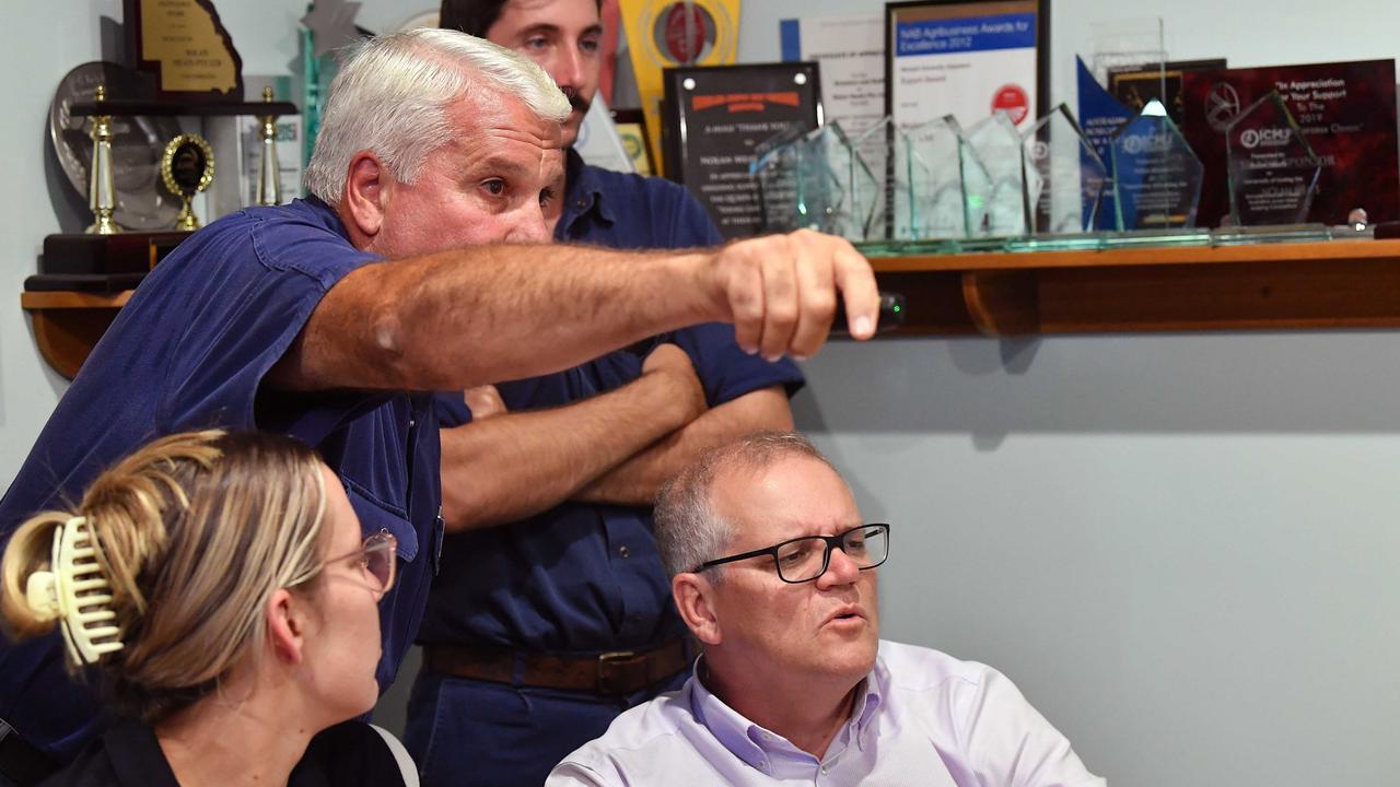 Nolan Meats director Terry Nolan (back left) showed videos and photos of the damage to the business during the February floods. Photo: Patrick Woods.