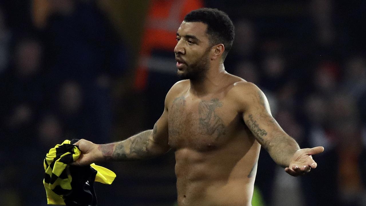 Troy Deeney leaves the pitch after being shown a red card