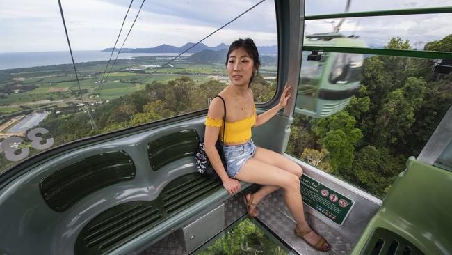 Canadian tourist Leah Zhao travels on the SkyRail Rainforest Cableway in Cairns. Picture: Brian Cassey.