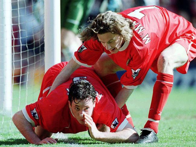 05 apr 1999 $$ FEE APPLIES $$ Robbie Fowler of Liverpool celebrates by sniffing the white line after scoring his first goal during the Liverpool vs Everton FA Carling Premiership match at Anfield  Mandatory/Credit: Ross/Kinnaird/ALLSPORT FEE APPLIES. sport soccer o/seas britain