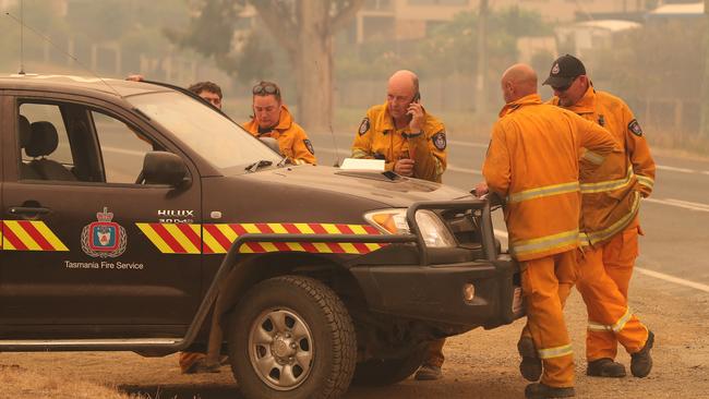 Firefighters opposite the Kermandie Hotel in Port Huon. Picture: NIKKI DAVIS-JONES